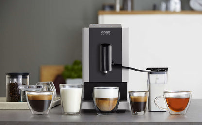 CASO Café Crema Touch Machine à café automatique design avec tuyau et réservoir à lait, broyeur conique réglable en continu, prêt à l'emploi, toutes les spécialités de café par toucher, noir, acier